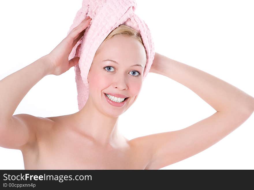 Beautiful woman in towel on head with blue eye and smile white teeth on white background