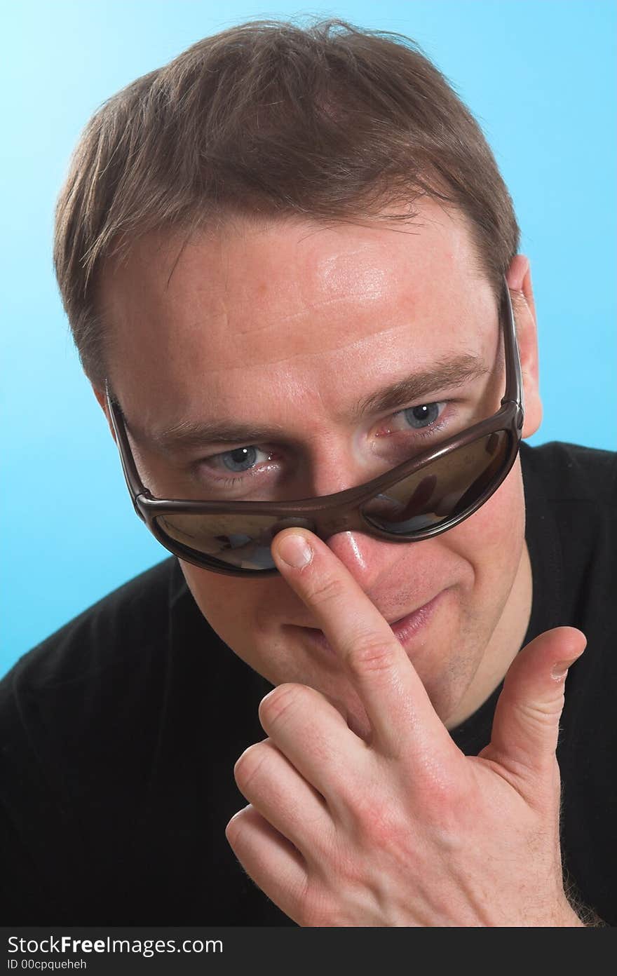 Face close up of a man over blue background. Face close up of a man over blue background