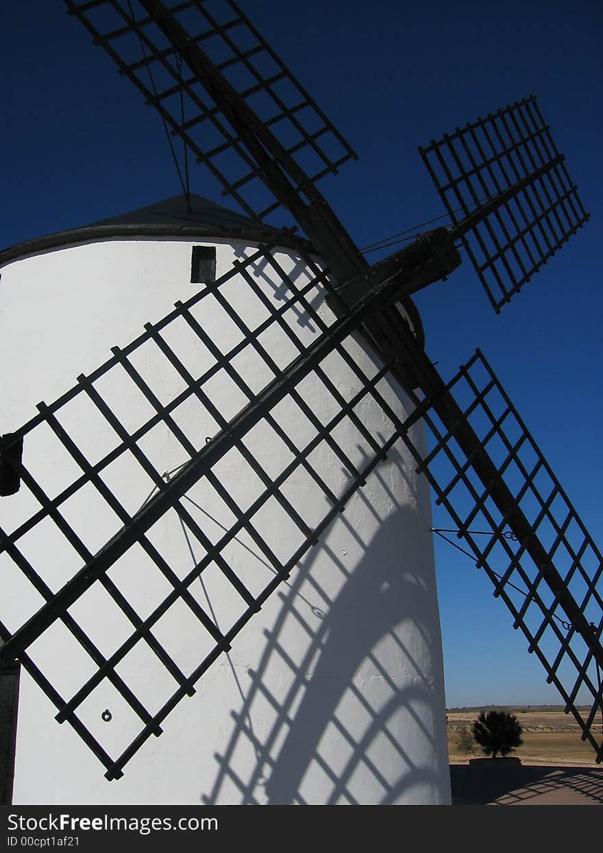 White mill in a sunny day with a blue sky. White mill in a sunny day with a blue sky