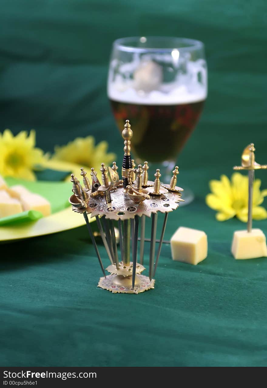 Decorative rapiers with cheese and beer. Decorative rapiers with cheese and beer