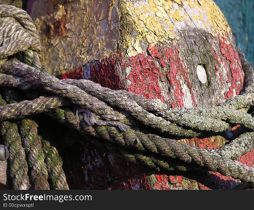 Close up shot of a worn lobster pot and rope at Motiff #1 in Rockport, MA. Close up shot of a worn lobster pot and rope at Motiff #1 in Rockport, MA