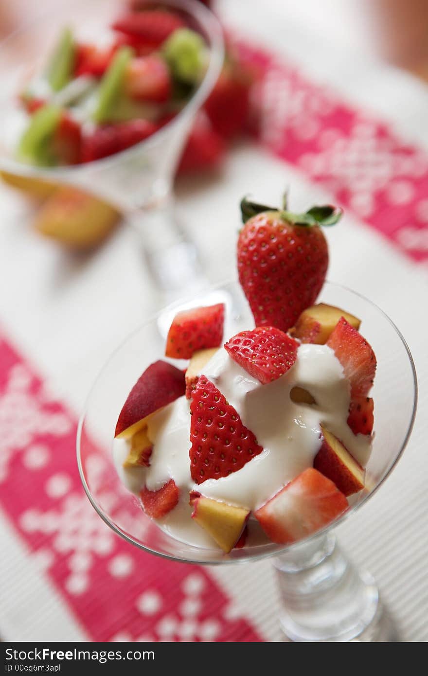 Summer fruit salads (strawberries, peaches & kiwi) - shallow depth of field. Summer fruit salads (strawberries, peaches & kiwi) - shallow depth of field