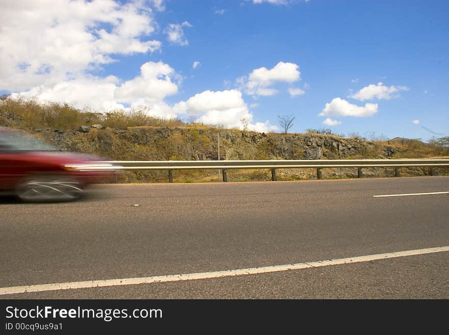 A fast blury moving car. A fast blury moving car.