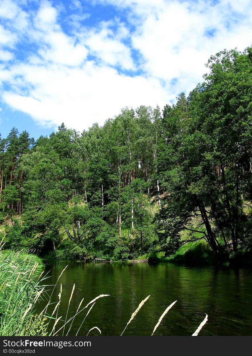 River, forest and cloudly sky, beauty place, rest time. River, forest and cloudly sky, beauty place, rest time