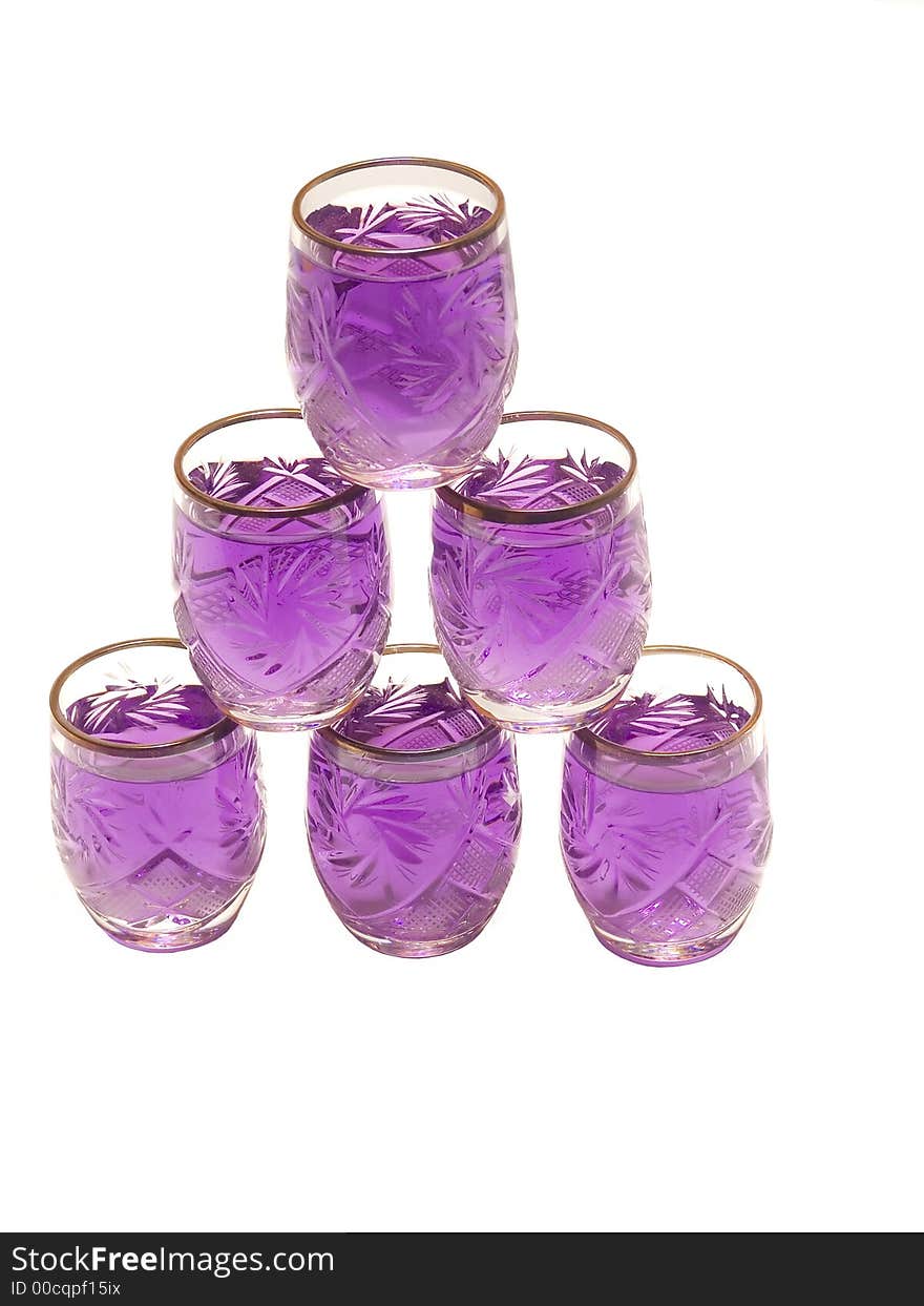 Glass pyramide of purple drink. Glass pyramide of purple drink