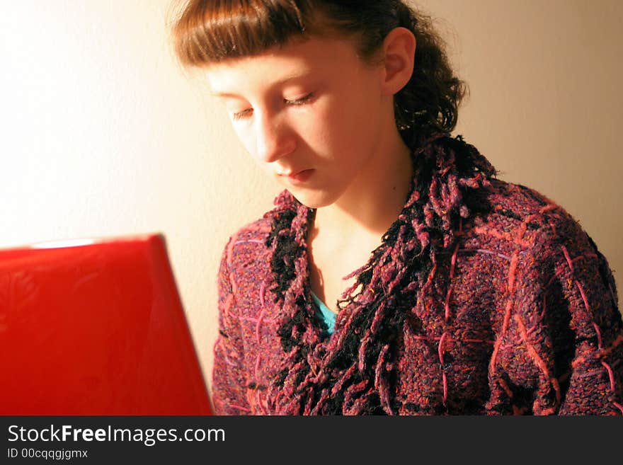 A young girl with her laptop computer on the internet. A young girl with her laptop computer on the internet.