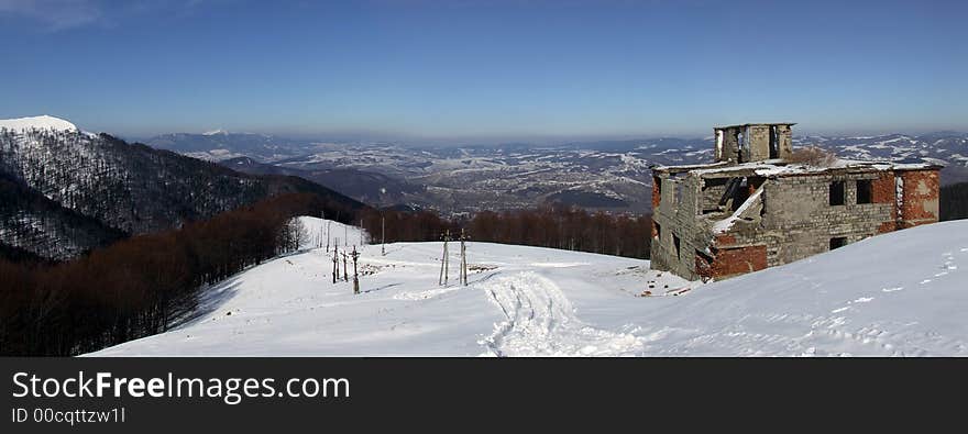 Panoramic picture of abandoned house and faraway mountain. Panoramic picture of abandoned house and faraway mountain