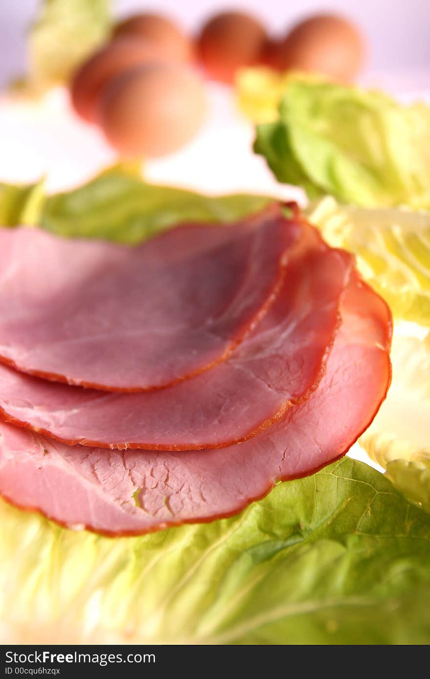 Delicious fresh sliced meat on salad