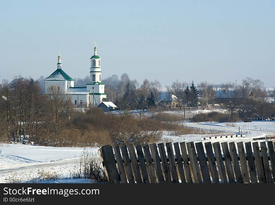 Kind of village with church on a background of the blue homogeneous sky. Kind of village with church on a background of the blue homogeneous sky