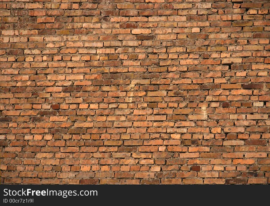 Old flat brick wall from a brown brick. Old flat brick wall from a brown brick.