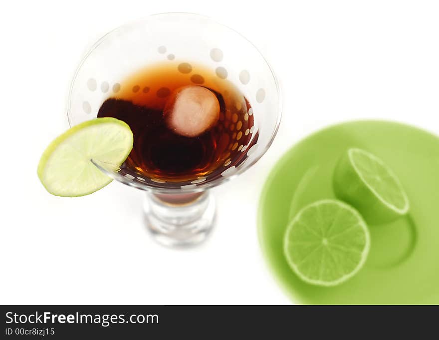 Isolated alcohol drink with lemon.