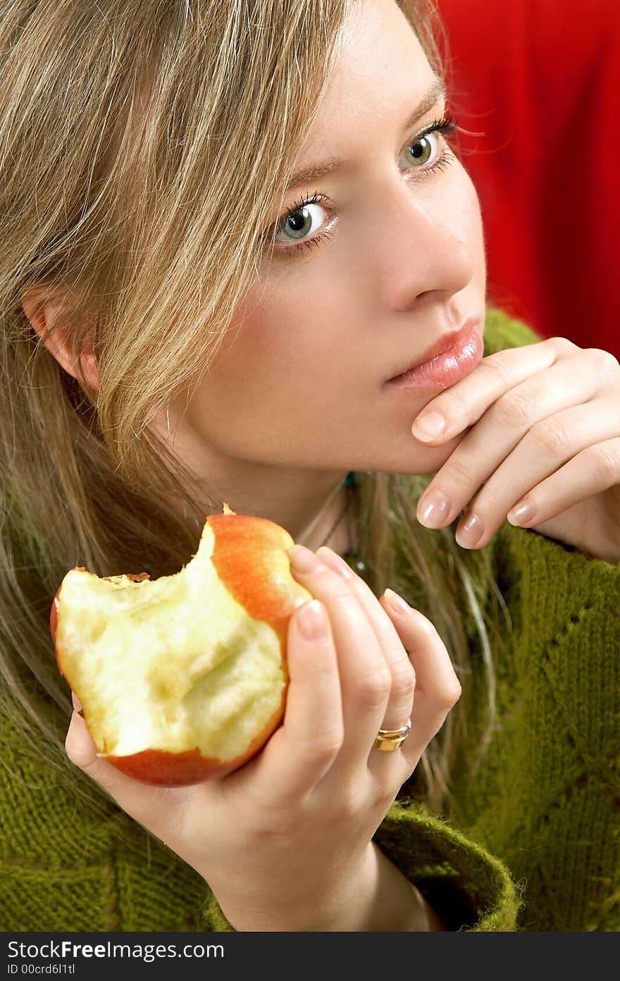 Pretty girl is holding a juicy apple in  palm. Pretty girl is holding a juicy apple in  palm