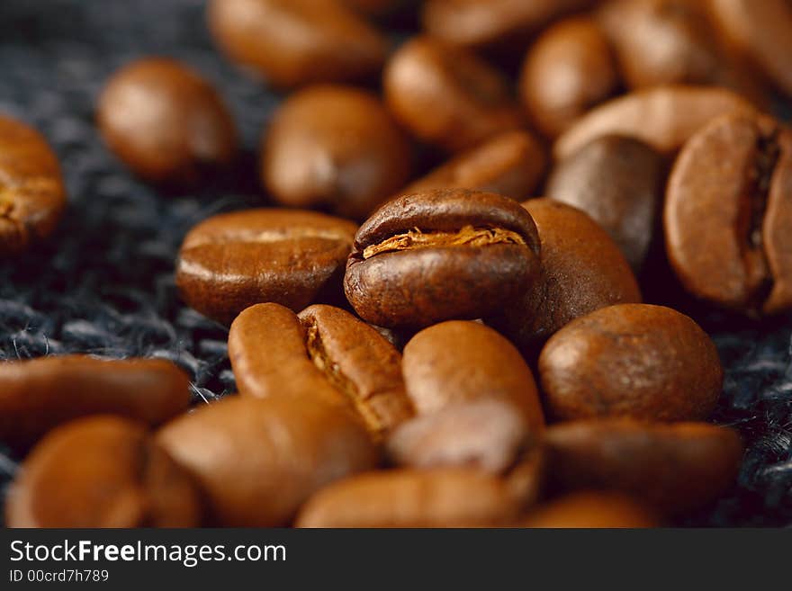 Coffee beans on blue jute