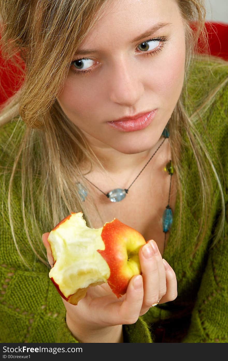 Pretty girl is holding a juicy apple in  palm. Pretty girl is holding a juicy apple in  palm