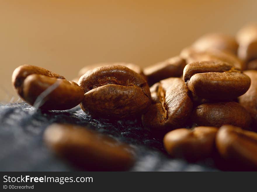 Coffee beans on blue jute