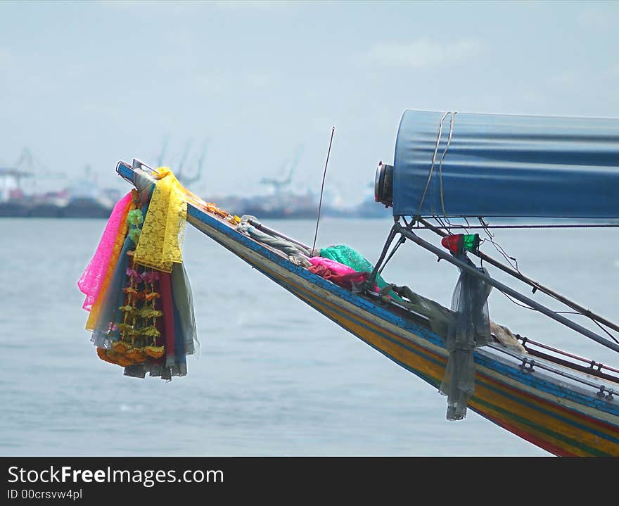 Bow of traditional, wooden longtail boat on the Chao Praya river in Bangkok, Thailand. Bow of traditional, wooden longtail boat on the Chao Praya river in Bangkok, Thailand.