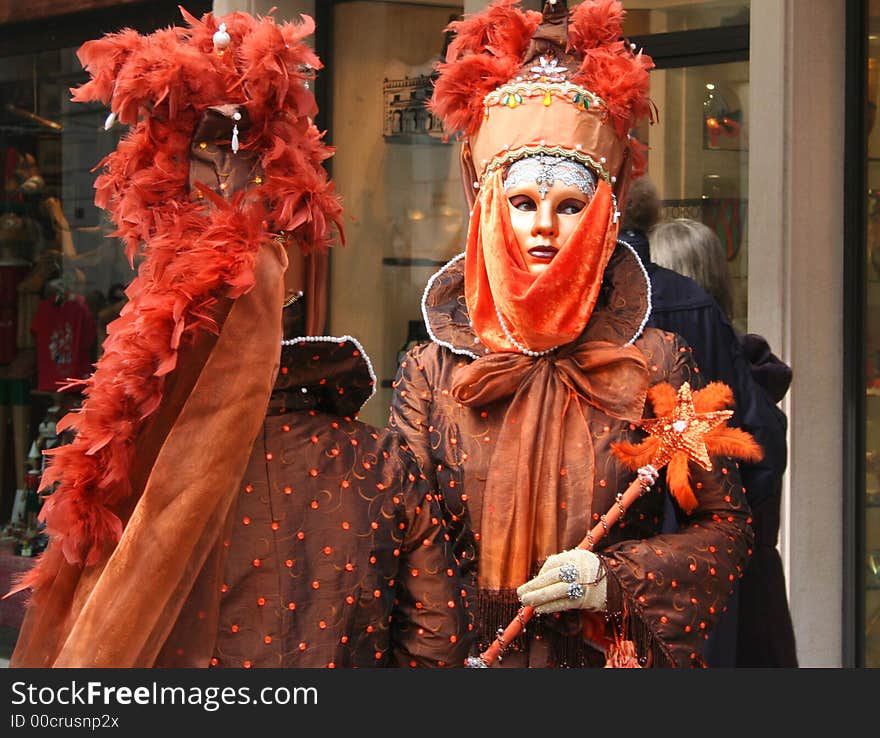 People dressed in brightly coloured costumes for Carnivale. People dressed in brightly coloured costumes for Carnivale.