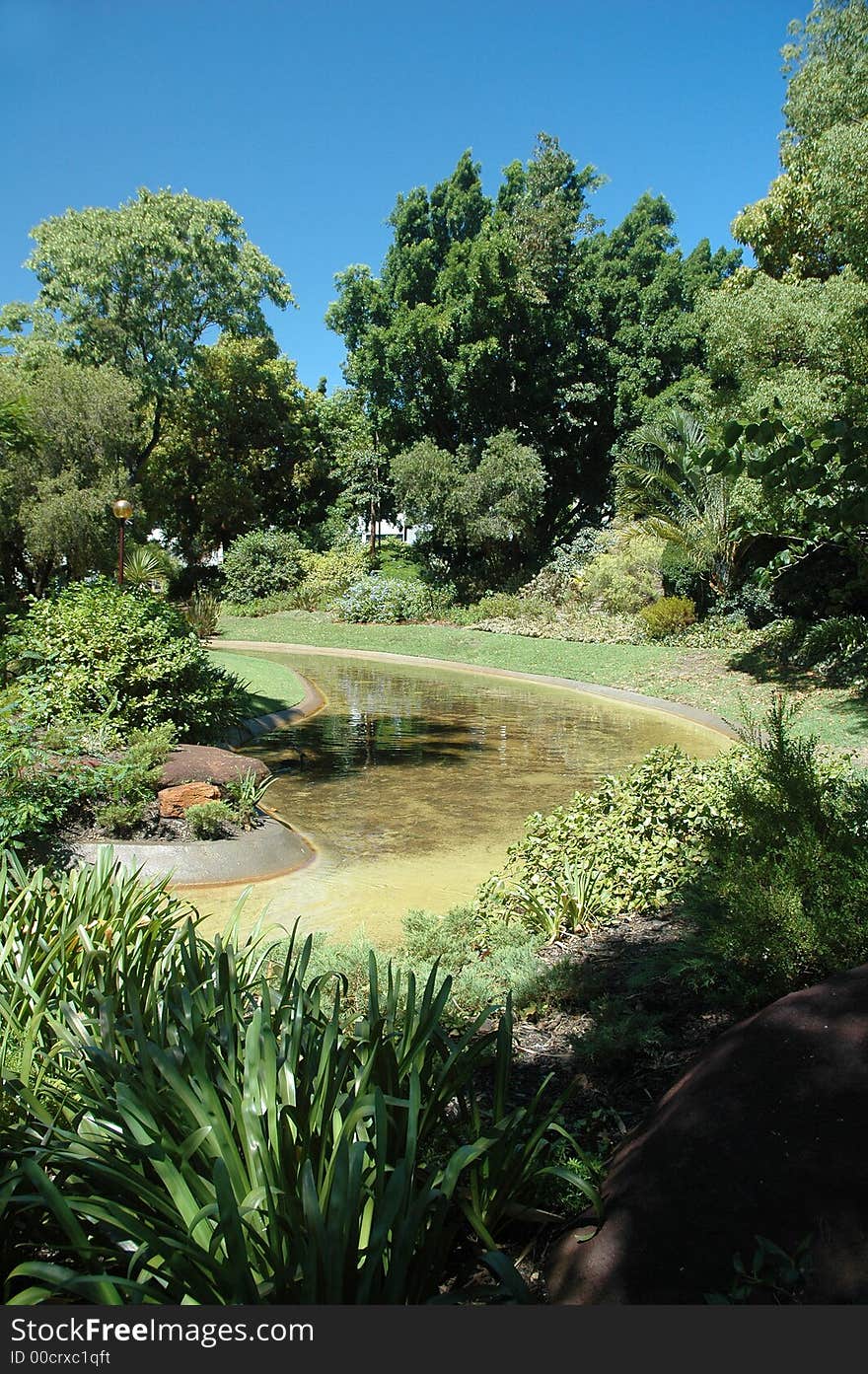 Lake and greens in an outdoor park. Lake and greens in an outdoor park