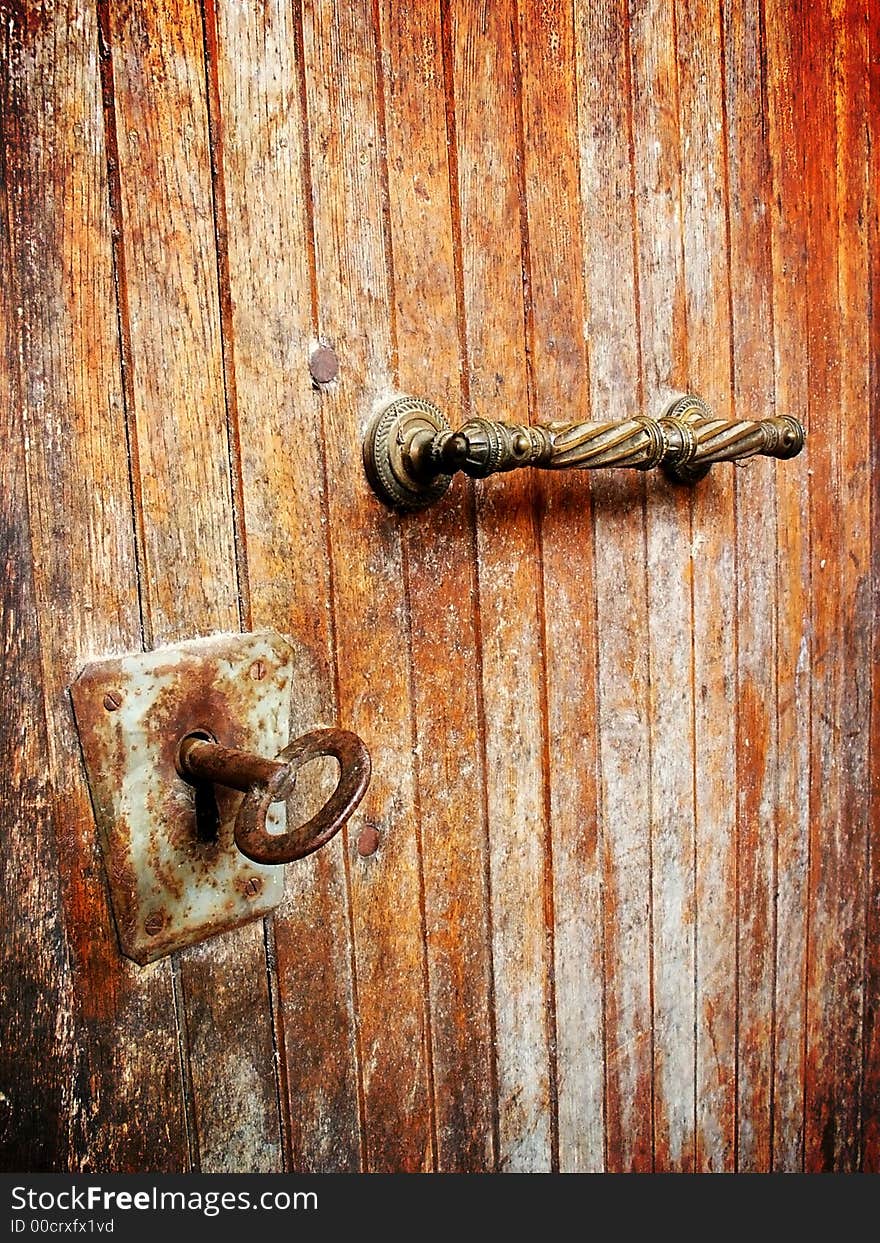 Old iron lock on old doors. Old iron lock on old doors