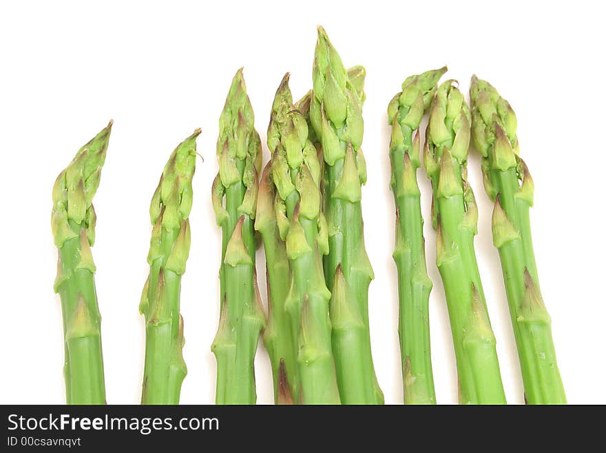 Shot of asparagus on top of white