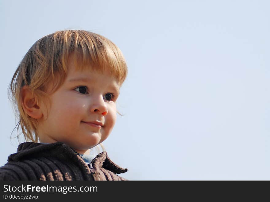 Child portrait with blue sky background. Child portrait with blue sky background