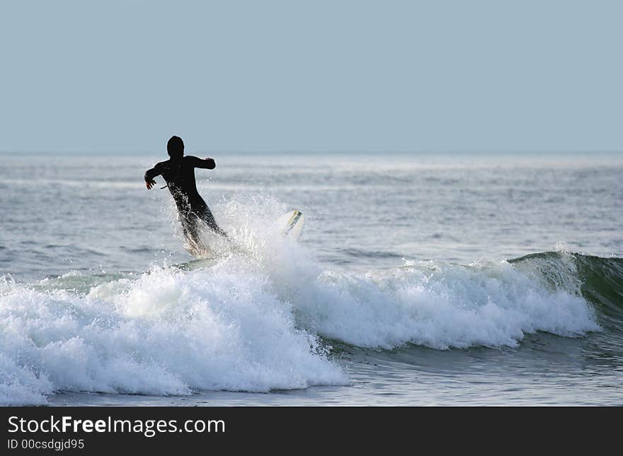 Surfer falling in the sea