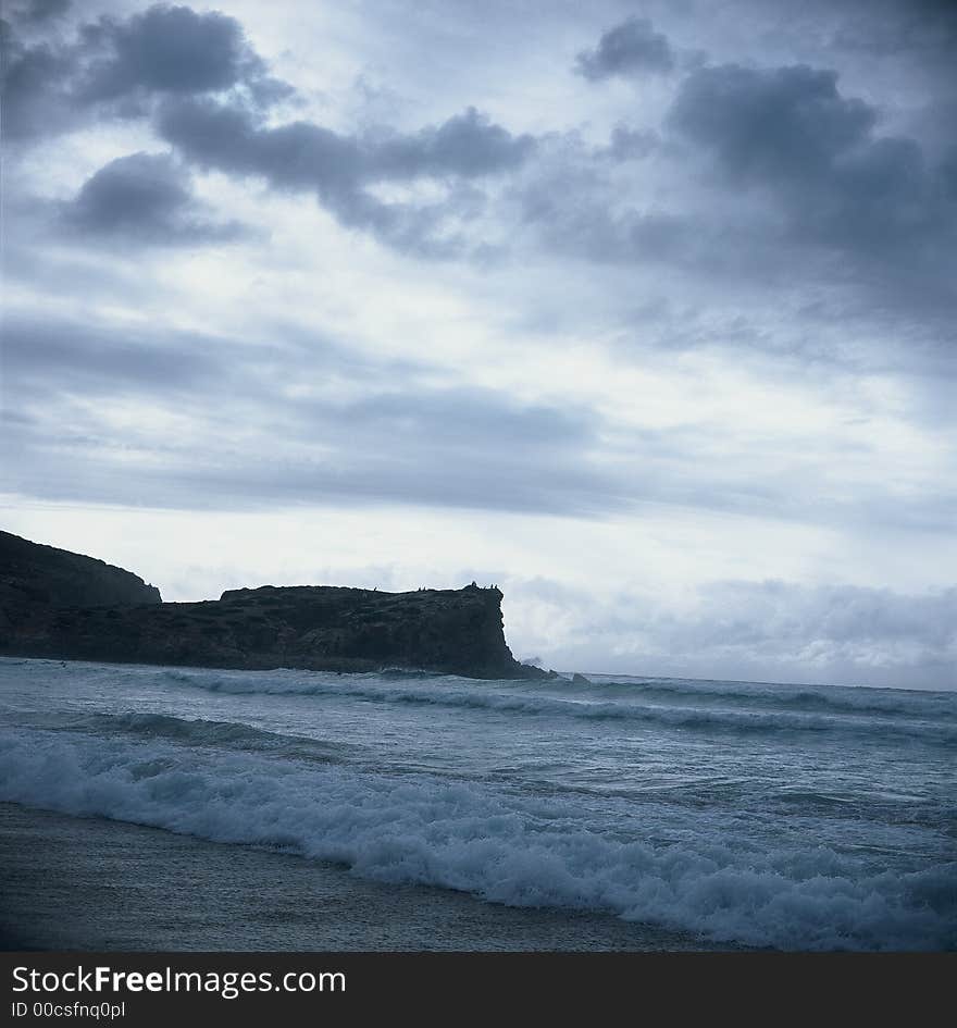 Black cliff and waves of the atlantic sea. Black cliff and waves of the atlantic sea