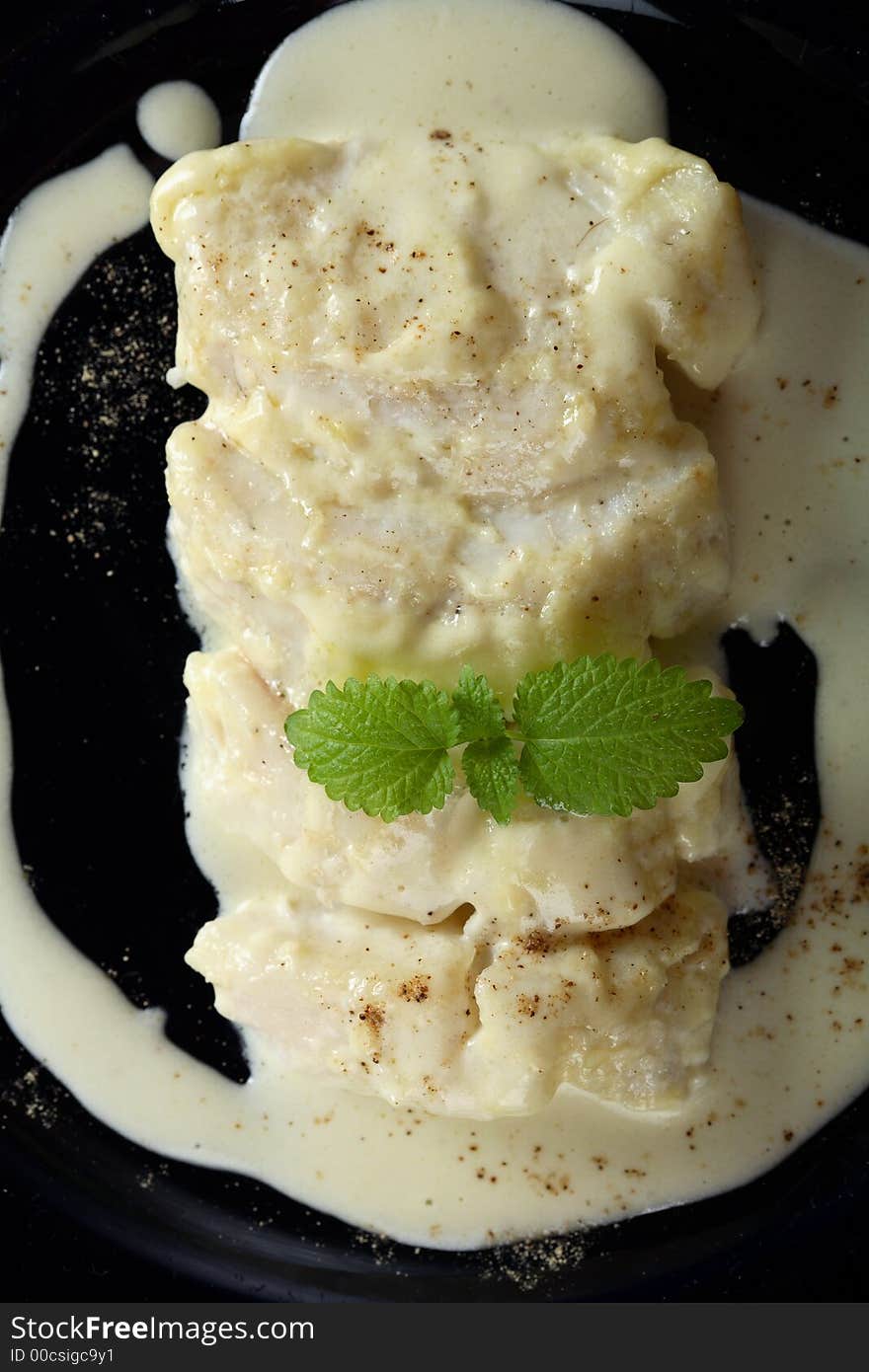 Delicious oven cod in creamy dressing with mint