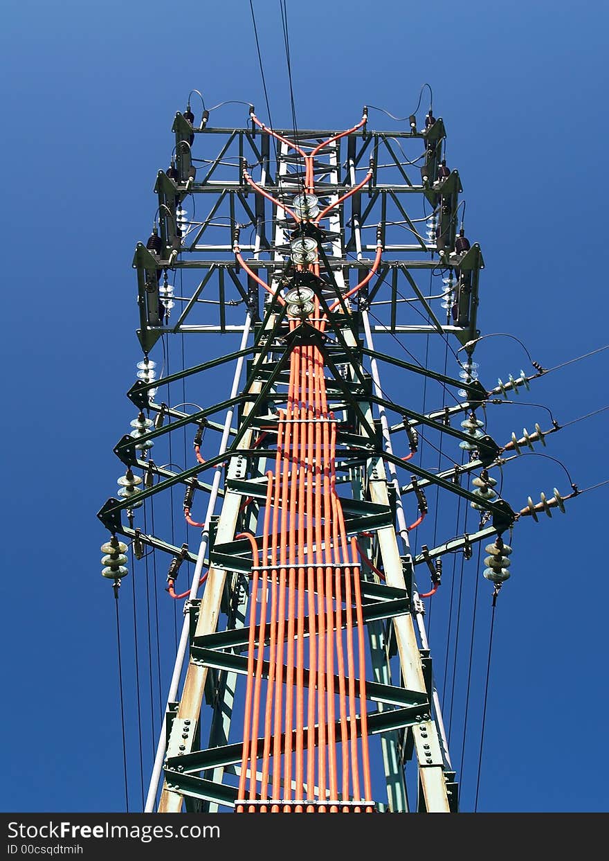 Solitary electricity pylon - against a blue sky