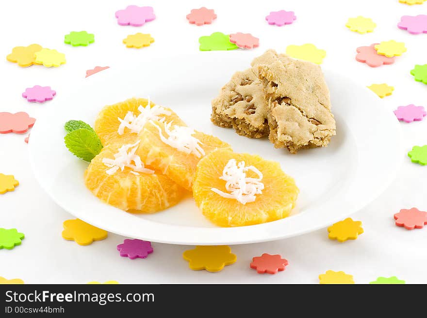 I scattered sponge dots over the table, then served orange slices topped with coconut and added butterscotch brownies,(Praline squares). I scattered sponge dots over the table, then served orange slices topped with coconut and added butterscotch brownies,(Praline squares).