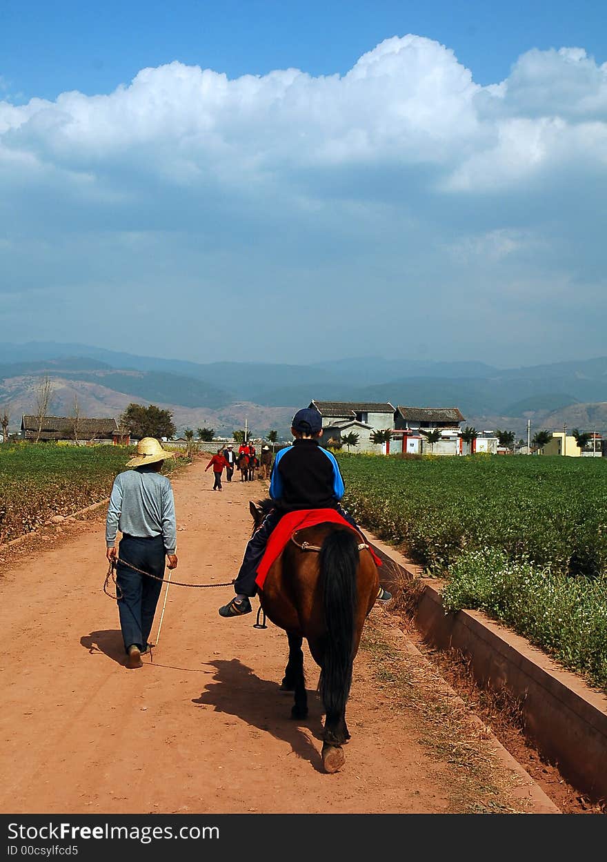 My son riding ahorse in the countryside. My son riding ahorse in the countryside