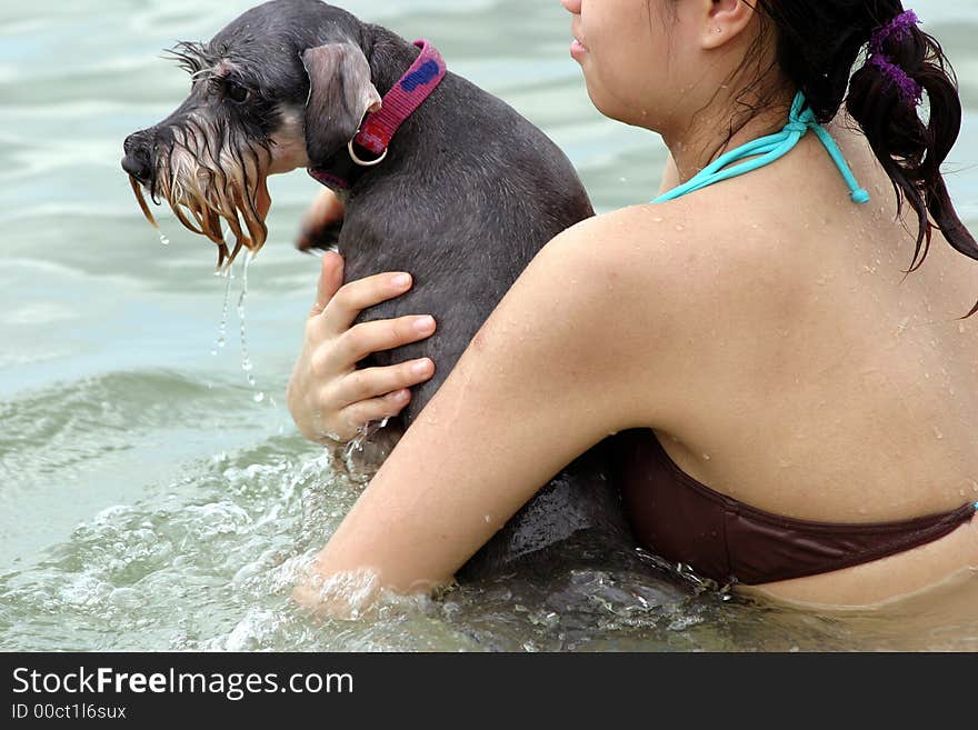 The Girl Swimming With A Pet