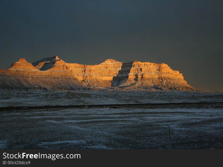 Orange Sunset on Striped Cliffs