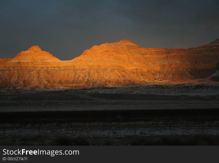 Orange Sunset on Striped Cliffs