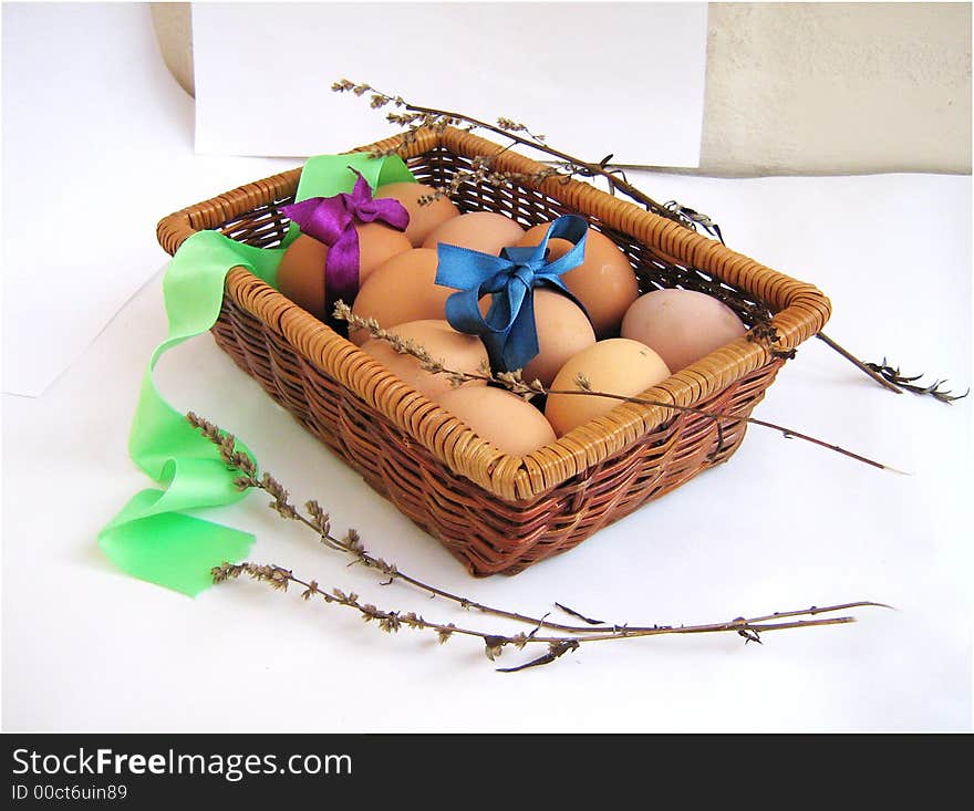 Basket Easter's eggs, object ower white, eggs with bows, herbs. Basket Easter's eggs, object ower white, eggs with bows, herbs