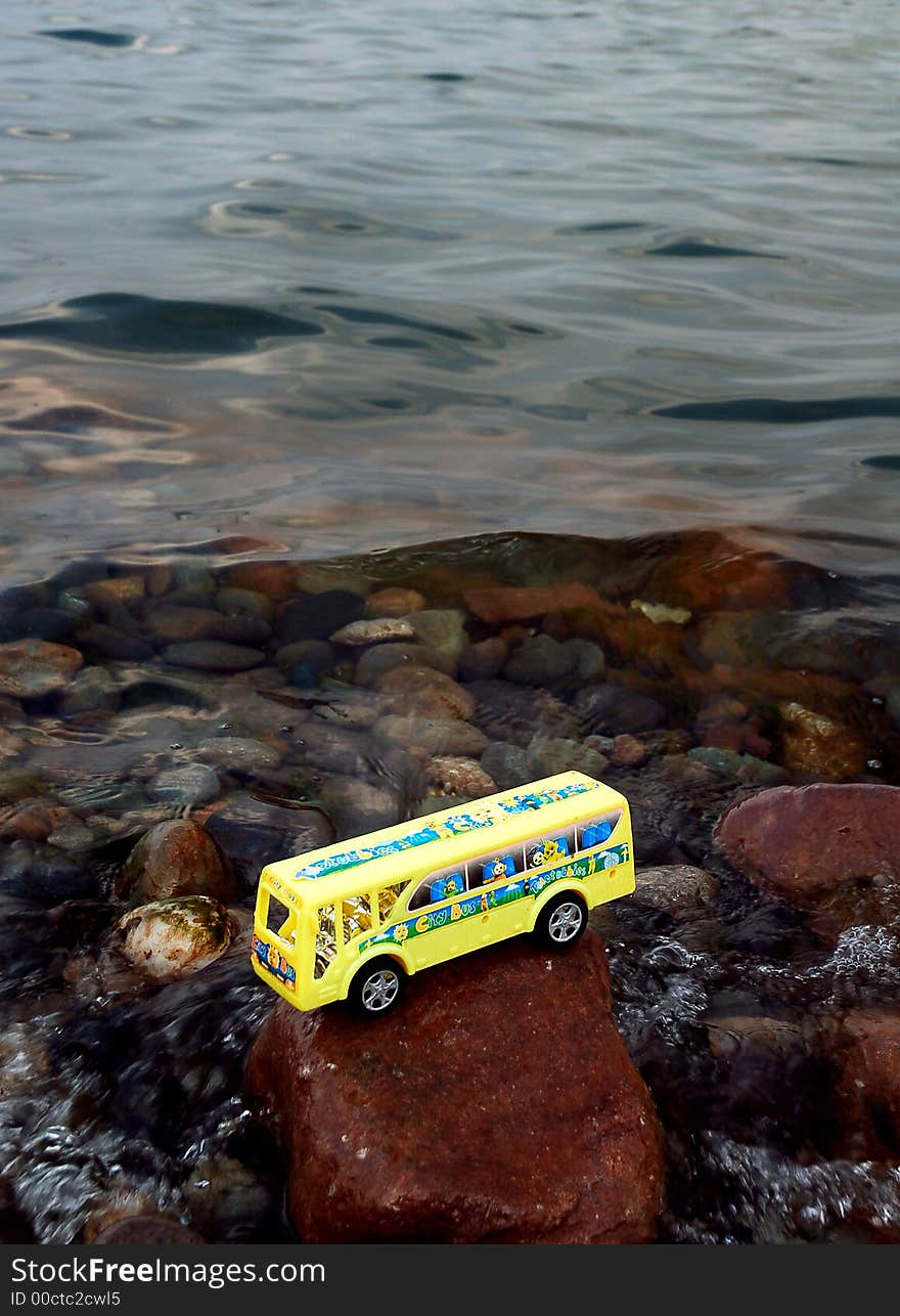 Toy school bus in water .meaning traffic accident