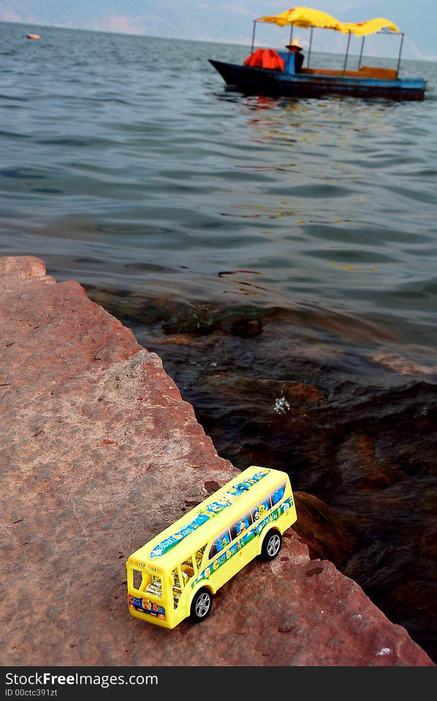 Toy school bus in water .meaning traffic accident