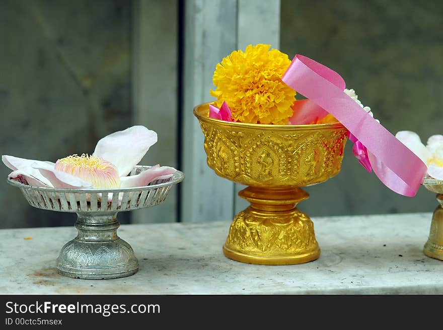 Flower offerings to the Buddha at a temple in Thailand