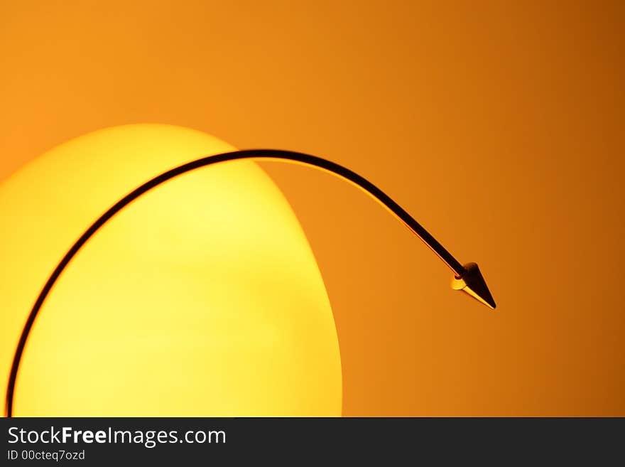 Yellow lamp-shade on orange background