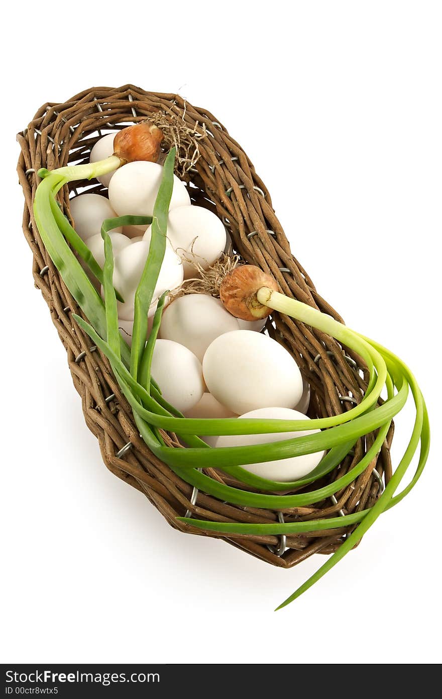 Basket with an onions and eggs