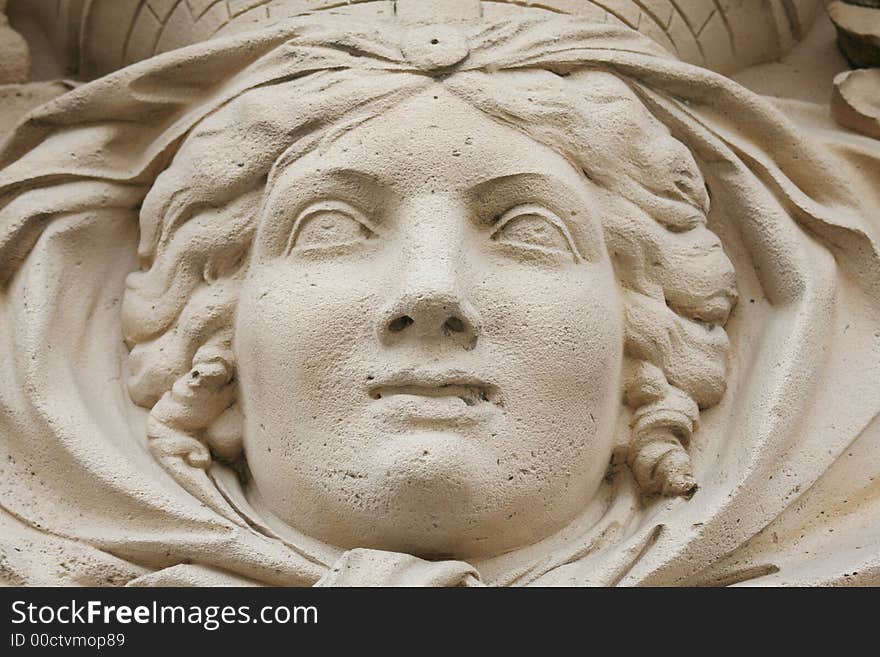 Antique stone statue woman face close-up. Antique stone statue woman face close-up