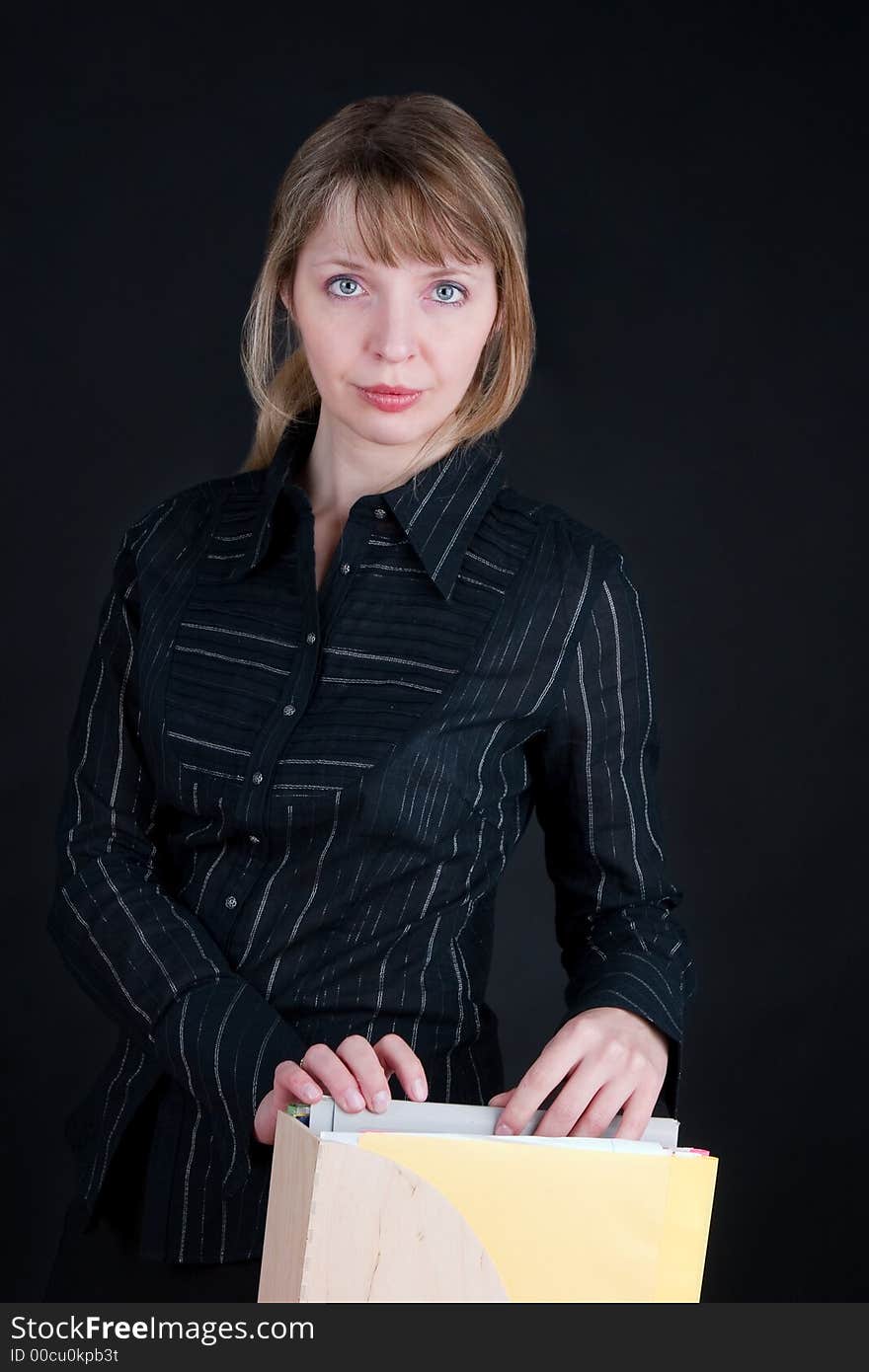 A Pretty Blond Woman Sorting Through Folders