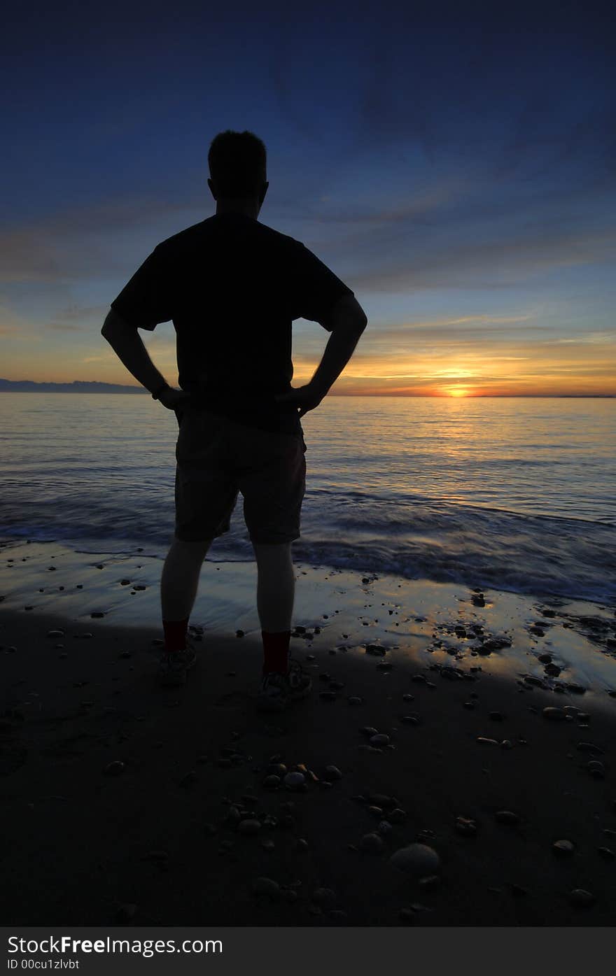 Watching the sunset over West Beach at Deception Pass State Park, Washington, USA. Watching the sunset over West Beach at Deception Pass State Park, Washington, USA