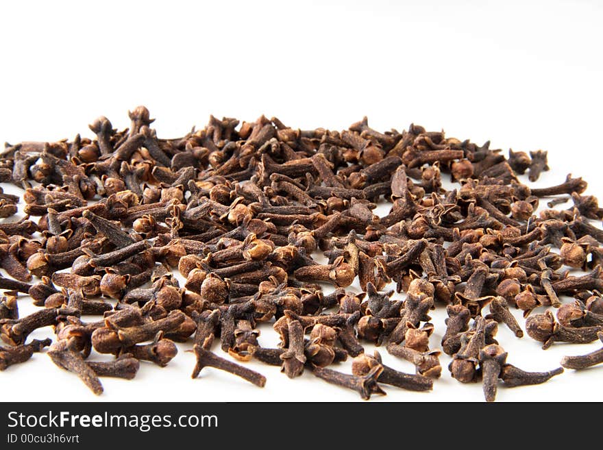 Whole cloves spices on white background