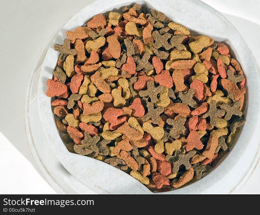 A bowl full of cat food