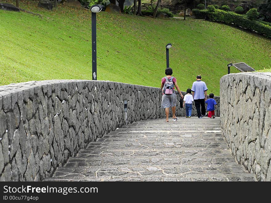 People walking down the stone road. People walking down the stone road