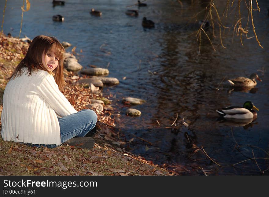 A girl in white at the lake