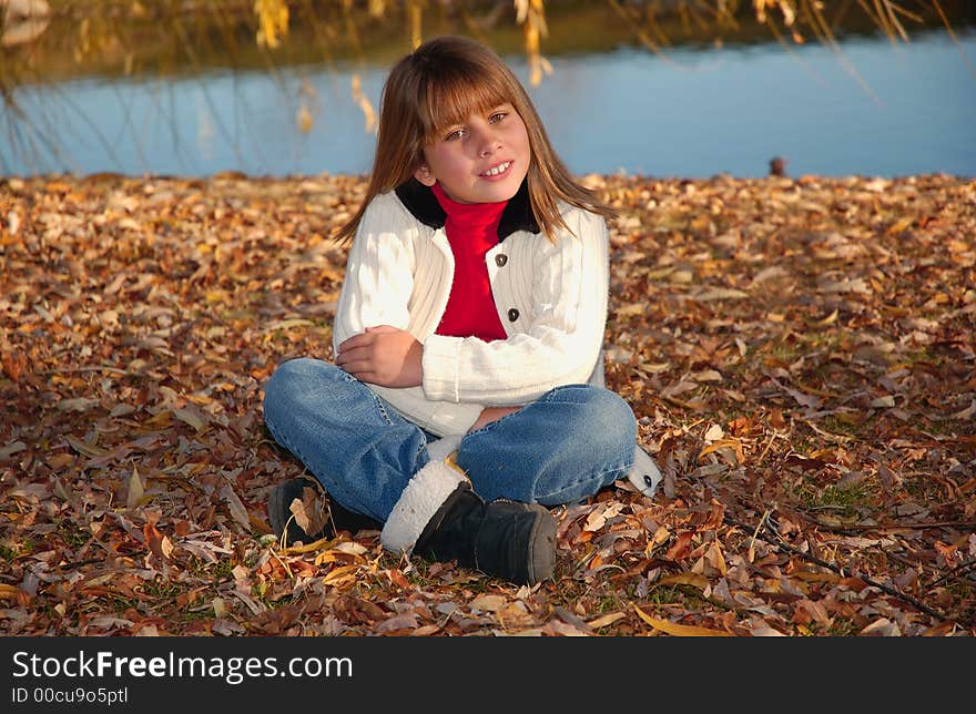 A girl in white at the lake