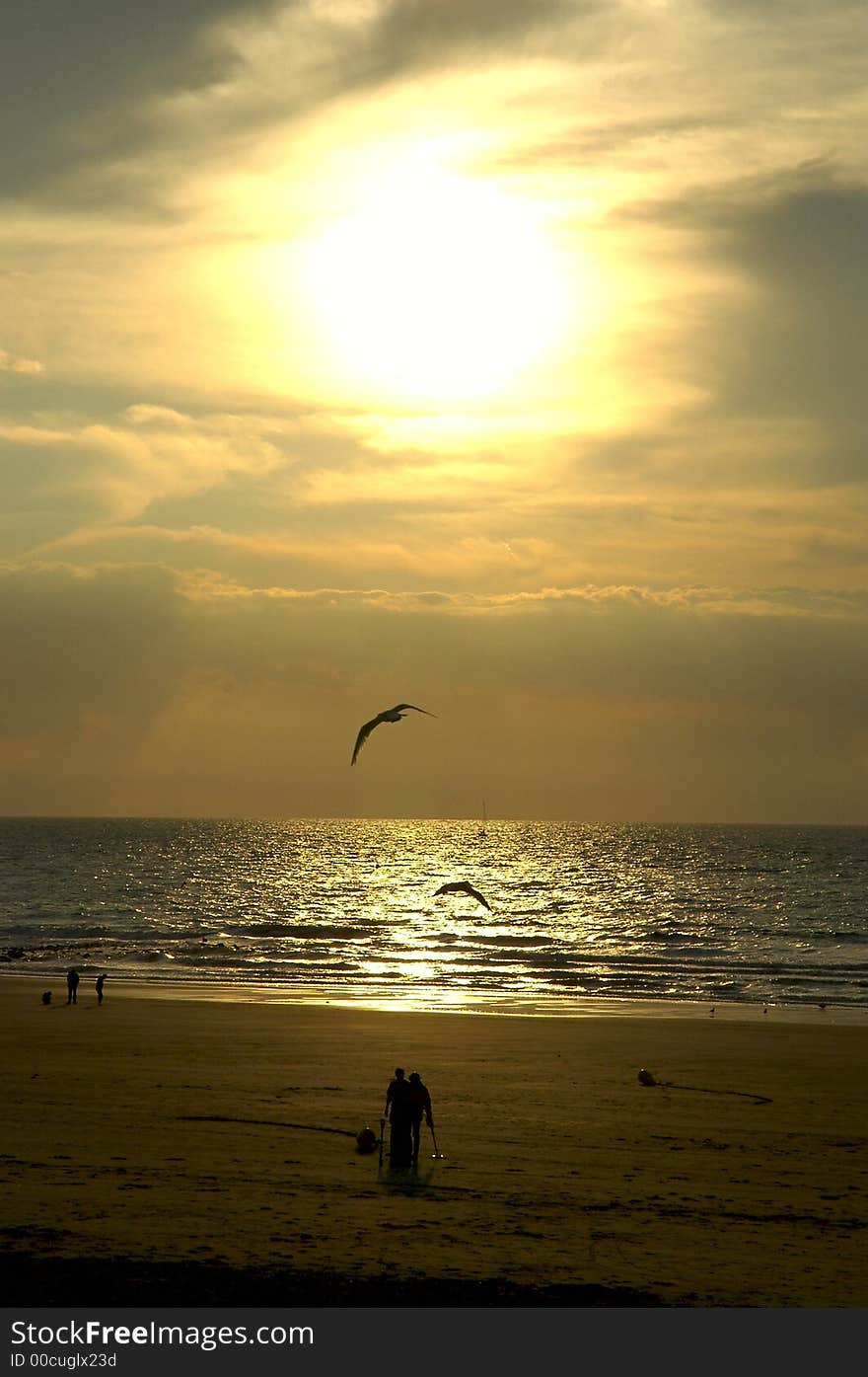 Sea sunset with people on the beach