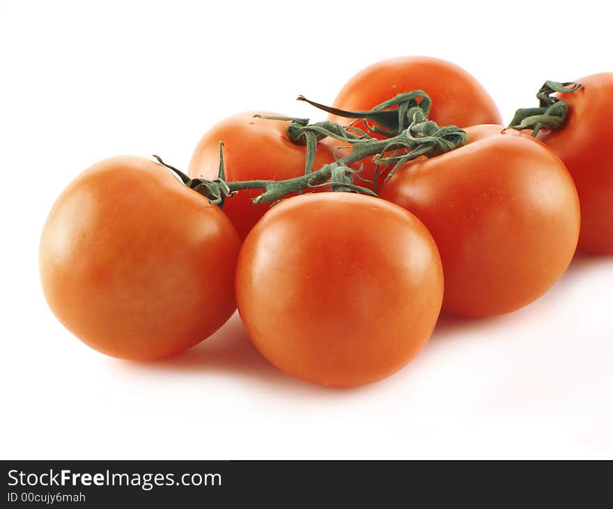 Red ripe tomatoes over a white background. Red ripe tomatoes over a white background